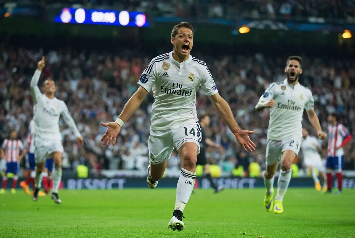 MADRID, SPAIN - APRIL 22: Javier Hernandez of Real Madrid CF (14) celebrates as he scores their first goal during the UEFA Champions League quarter-final second leg match between Real Madrid CF and Club Atletico de Madrid at Bernabeu on April 22, 2015 in Madrid, Spain. (Photo by Gonzalo Arroyo Moreno/Getty Images).
