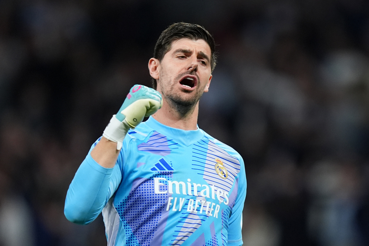 MADRID, SPAIN - FEBRUARY 19: Thibaut Courtois celebrates after Kylian Mbappe of Real Madrid (not pictured) scored their sides second goal during the UEFA Champions League 2024/25 League Knockout Play-off second leg match between Real Madrid C.F. and Manchester City at Santiago Bernabeu Stadium on February 19, 2025 in Madrid, Spain. (Photo by Angel Martinez/Getty Images)