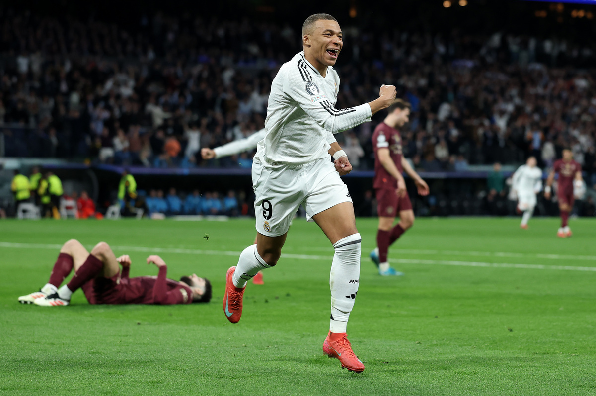 MADRID, SPAIN - FEBRUARY 19: Kylian Mbappe of Real Madrid celebrates scoring his team's second goal during the UEFA Champions League 2024/25 League Knockout Play-off second leg match between Real Madrid C.F. and Manchester City at Santiago Bernabeu Stadium on