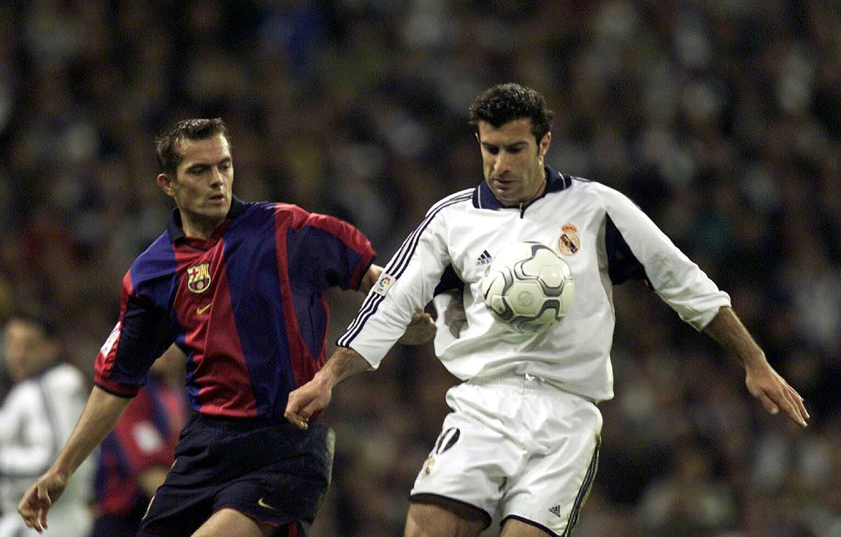 3 Mar 2001: Lusi Figo of Real Madrid holds off Philip Cocu of Barcelona during the Real Madrid v FC Barcelona La Liga match played at the Santiago Bernabeau, Madrid. Mandatory Credit: Firo Photo/ALLSPORT