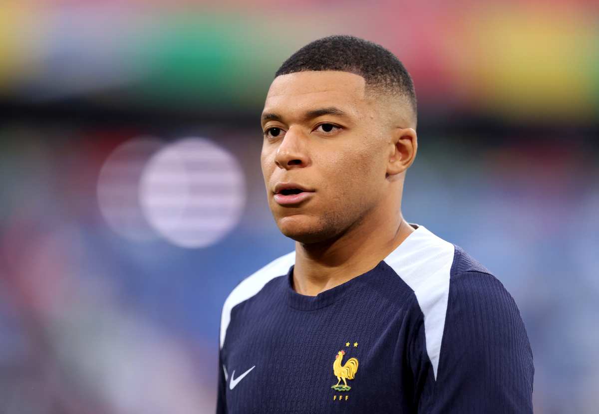 MUNICH, GERMANY - JULY 09: Kylian Mbappe of France looks on as he warms up prior to the UEFA EURO 2024 Semi-Final match between Spain and France at Munich Football Arena on July 09, 2024 in Munich, Germany. (Photo by Alex Livesey/Getty Images)