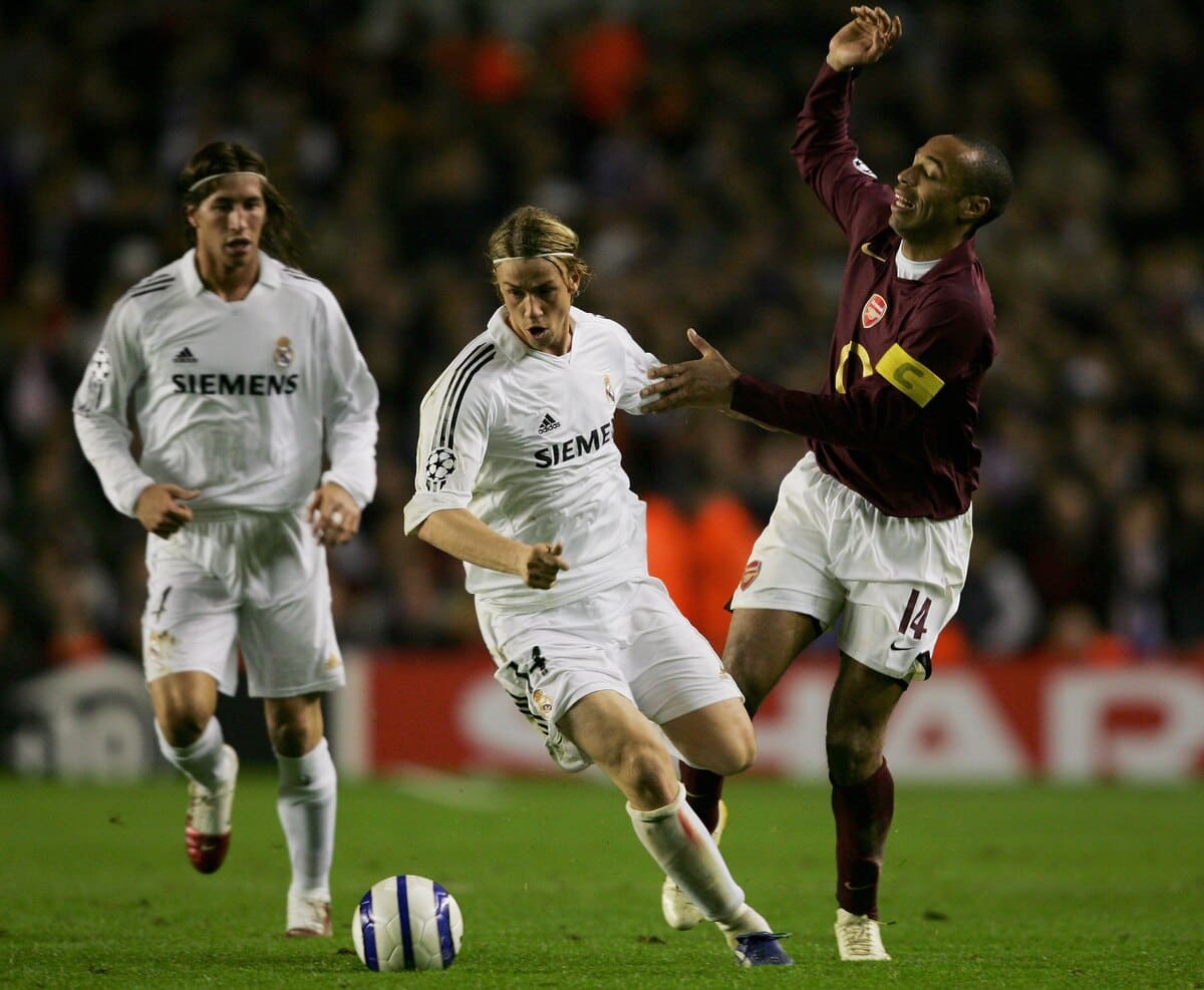 LONDON - MARCH 08: Guti of Real Madrid battles with Thierry Henry of Arsenal during the UEFA Champions League Round of 16, Second Leg match between Arsenal and Real Madrid at Highbury Stadium on March 8, 2006 in London, England. (Photo by Shaun Botterill/Getty Images)