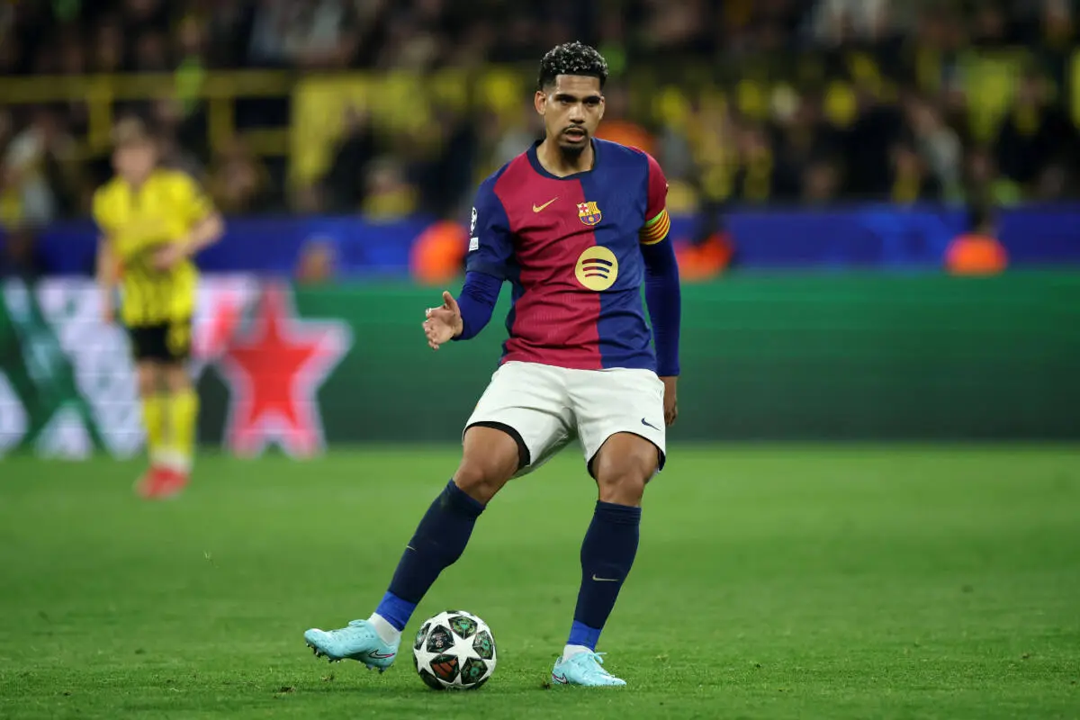 DORTMUND, GERMANY - APRIL 15: Ronald Araújo of FC Barcelona controls the ball during the UEFA Champions League 2024/25 Quarter Final Second Leg match between Borussia Dortmund and FC Barcelona at BVB Stadion Dortmund on April 15, 2025 in Dortmund, Germany. (Photo by Alex Grimm/Getty Images)