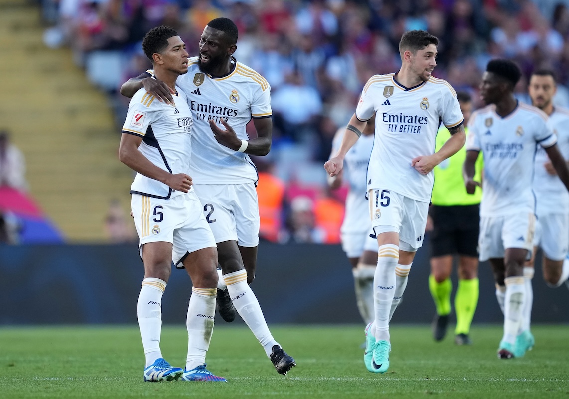 BARCELONA, SPAIN - OCTOBER 28: Jude Bellingham of Real Madrid celebrates with Antonio Ruediger of Real Madrid after scoring the team's first goal to equalise during the LaLiga EA Sports match between FC Barcelona and Real Madrid CF at Estadi Olimpic Lluis Companys on October 28, 2023 in Barcelona, Spain. (Photo by Alex Caparros/Getty Images)