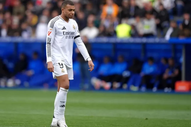 VITORIA-GASTEIZ, SPAIN - APRIL 13: Kylian Mbappe of Real Madrid leaves the pitch after receiving a red card during the LaLiga match between Deportivo Alaves and Real Madrid CF at Estadio de Mendizorroza on April 13, 2025 in Vitoria-Gasteiz, Spain. (Photo by Juan Manuel Serrano Arce/Getty Images)