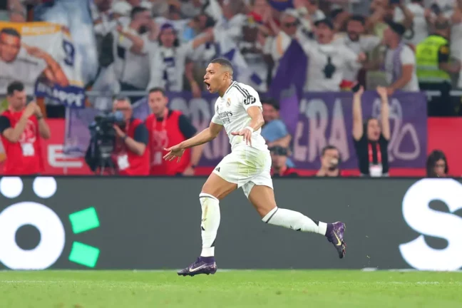 SEVILLE, SPAIN - APRIL 26: Kylian Mbappe of Real Madrid celebrates scoring his team's first goal during the Copa del Rey Final match between FC Barcelona and Real Madrid at Estadio de La Cartuja on April 26, 2025 in Seville, Spain. (Photo by Fran Santiago/Getty Images)