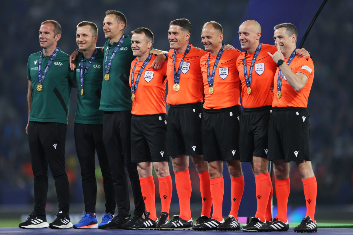 ISTANBUL, TURKEY - JUNE 10: (L-R) Match Officials Marco Fritz, Bartosz Frankowski, Tomasz Kwiatkowski, Vasile Marinescu, Istvan Kovacs, Pawel Sokolnicki, Szymon Marciniak and Tomasz Listkiewicz pose for a photo with their medals after the UEFA Champions League 2022/23 final match between FC Internazionale and Manchester City FC at Ataturk Olympic Stadium on June 10, 2023 in Istanbul, Turkey. (Photo by Michael Steele/Getty Images)