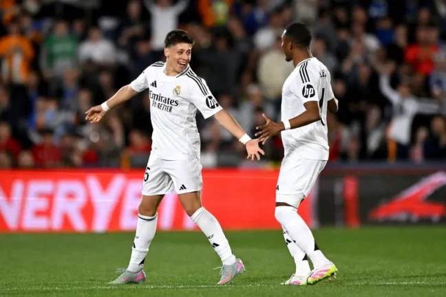 GETAFE, SPAIN - APRIL 23: Arda Gueler of Real Madrid celebrates scoring his team's first goal with teammate David Alaba during the LaLiga match between Getafe CF and Real Madrid CF at Coliseum Alfonso Perez on April 23, 2025 in Getafe, Spain. (Photo by Denis Doyle/Getty Images)