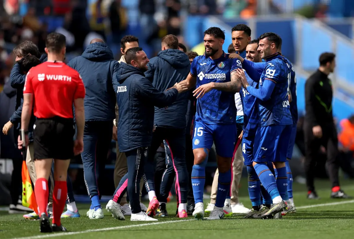 GETAFE, SPAIN - APRIL 12: Omar Alderete of Getafe CF celebrates scoring his team's first goal with his teammates and backroom staff during the LaLiga match between Getafe CF and UD Las Palmas at Coliseum Alfonso Perez on April 12, 2025 in Getafe, Spain. (Photo by Florencia Tan Jun/Getty Images)
