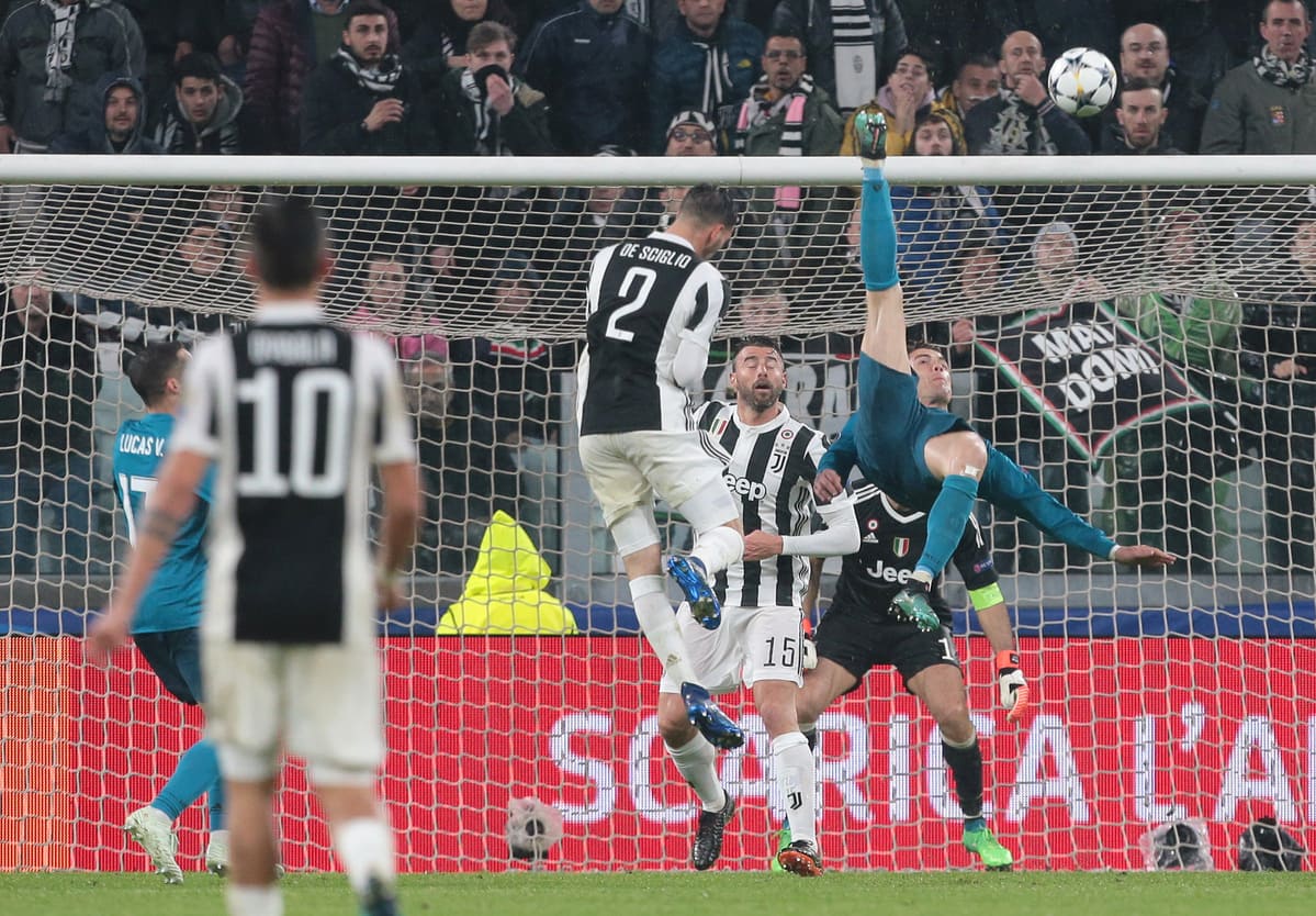 TURIN, ITALY - APRIL 03: Cristiano Ronaldo of Real Madrid scores his sides second goal during the UEFA Champions League Quarter Final Leg One match between Juventus and Real Madrid at Allianz Stadium on April 3, 2018 in Turin, Italy. (Photo by Emilio Andreoli/Getty Images)
