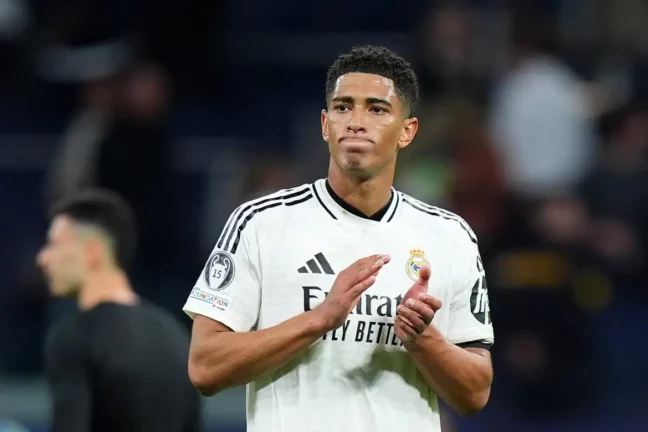 MADRID, SPAIN - APRIL 16: Jude Bellingham of Real Madrid applauds the fans after the team's defeat in the UEFA Champions League 2024/25 Quarter Final Second Leg match between Real Madrid C.F. and Arsenal FC at Estadio Santiago Bernabeu on April 16, 2025 in Madrid, Spain. (Photo by Angel Martinez/Getty Images)