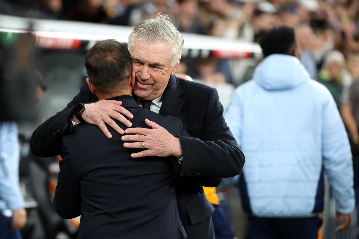 MADRID, SPAIN - MARCH 29: Carlo Ancelotti, Head Coach of Real Madrid, and Borja Jimenez, Head Coach of CD Leganes, interact prior to the LaLiga match between Real Madrid CF and CD Leganes at Estadio Santiago Bernabeu on March 29, 2025 in Madrid, Spain. (Photo by Florencia Tan Jun/Getty Images)