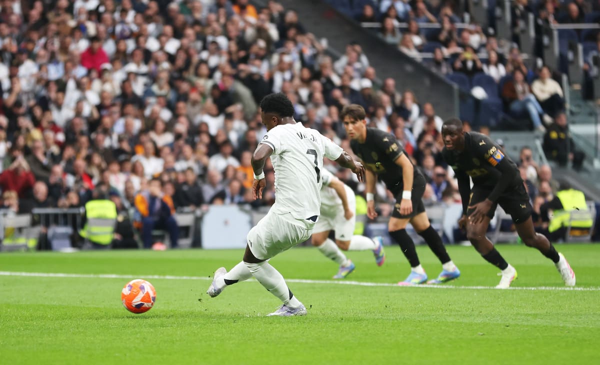 MADRID, SPAIN - APRIL 05: Vinicius Junior of Real Madrid takes a penalty that is saved by Giorgi Mamardashvili of Valencia CF (not pictured) during the LaLiga match between Real Madrid CF and Valencia CF at Estadio Santiago Bernabeu on April 05, 2025 in Madrid, Spain. (Photo by Florencia Tan Jun/Getty Images)