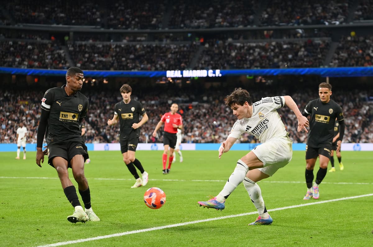MADRID, SPAIN - APRIL 05: Fran Garcia of Real Madrid shoots at goal whilst under pressure from Cristhian Mosquera of Valencia CF during the LaLiga match between Real Madrid CF and Valencia CF at Estadio Santiago Bernabeu on April 05, 2025 in Madrid, Spain. (Photo by Denis Doyle/Getty Images)