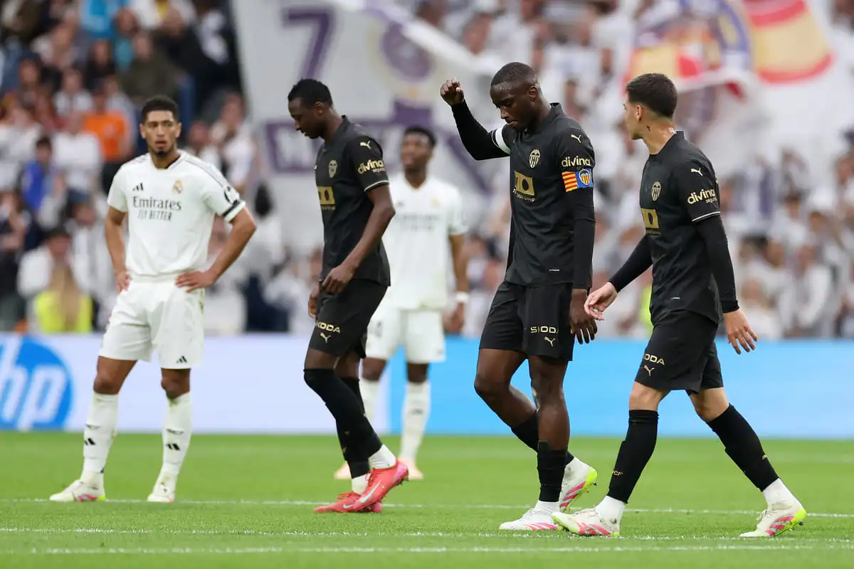 MADRID, SPAIN - APRIL 05: Mouctar Diakhaby of Valencia CF celebrates scoring his team's first goal with teammates during the LaLiga match between Real Madrid CF and Valencia CF at Estadio Santiago Bernabeu on April 05, 2025 in Madrid, Spain. (Photo by Florencia Tan Jun/Getty Images).