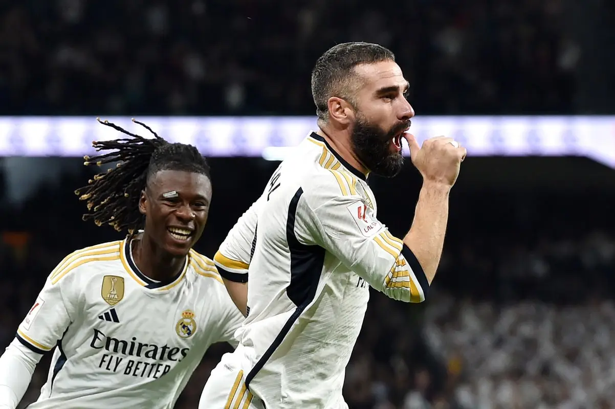 MADRID, SPAIN - NOVEMBER 11: Daniel Carvajal of Real Madrid (R) celebrates with teammate Eduardo Camavinga after scoring the team's first goal during the LaLiga EA Sports match between Real Madrid CF and Valencia CF at Estadio Santiago Bernabeu on November 11, 2023 in Madrid, Spain. (Photo by Denis Doyle/Getty Images)