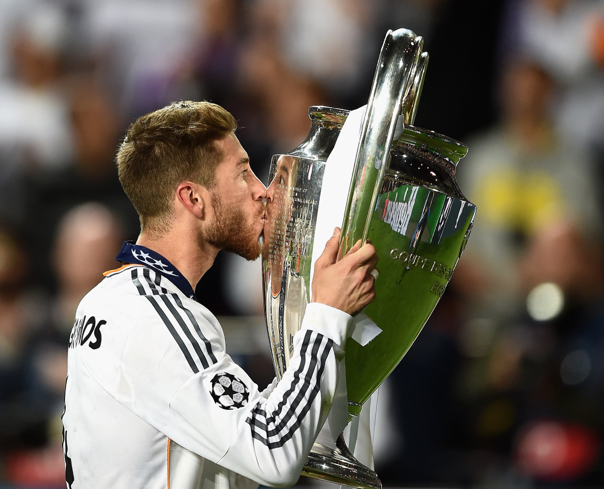 LISBON, PORTUGAL - MAY 24: Sergio Ramos of Real Madrid celebrates with the Champions League trophy after victory in the UEFA Champions League Final between Real Madrid and Atletico de Madrid at Estadio da Luz on May 24, 2014 in Lisbon, Portugal. (Photo by Laurence Griffiths/Getty Images)