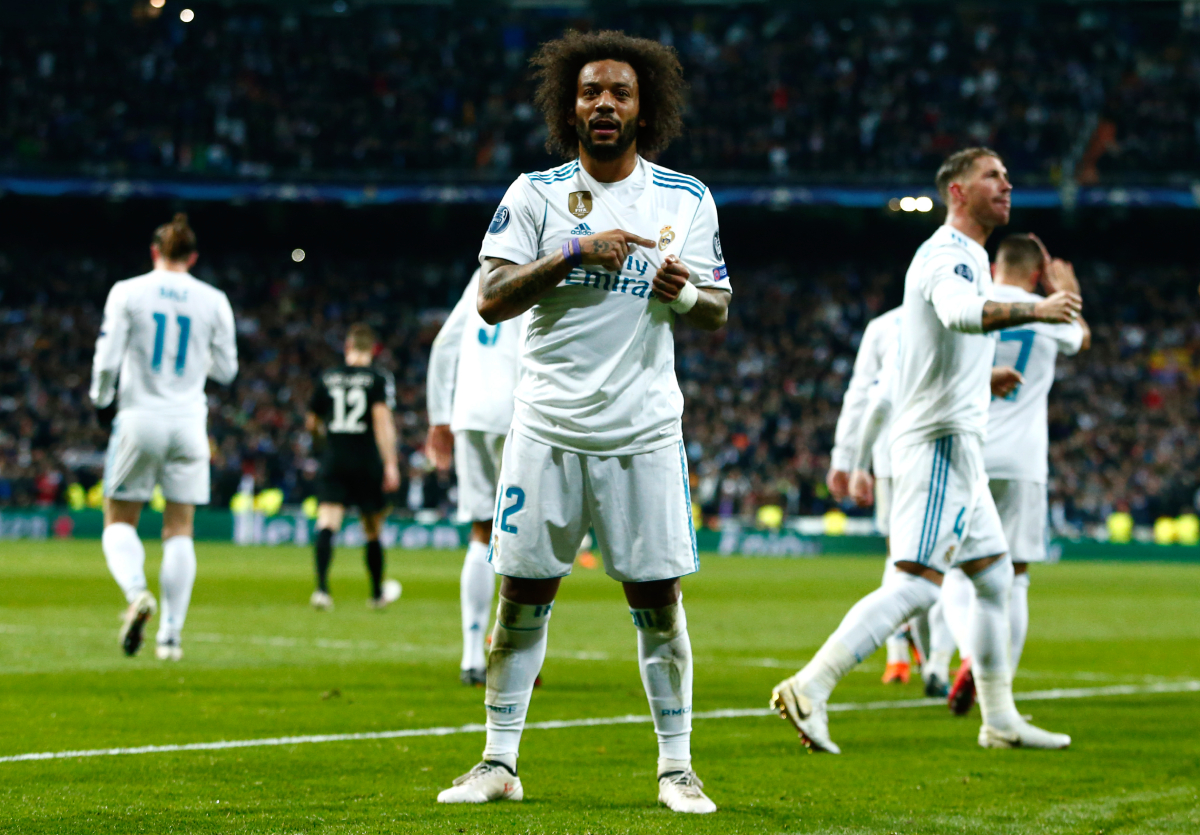 MADRID, SPAIN - FEBRUARY 14: Marcelo of Real Madrid celebrates scoring the 3rd Real Madrid goal during the UEFA Champions League Round of 16 First Leg match between Real Madrid and Paris Saint-Germain at Bernabeu on February 14, 2018 in Madrid, Spain. (Photo by Gonzalo Arroyo Moreno/Getty Images)