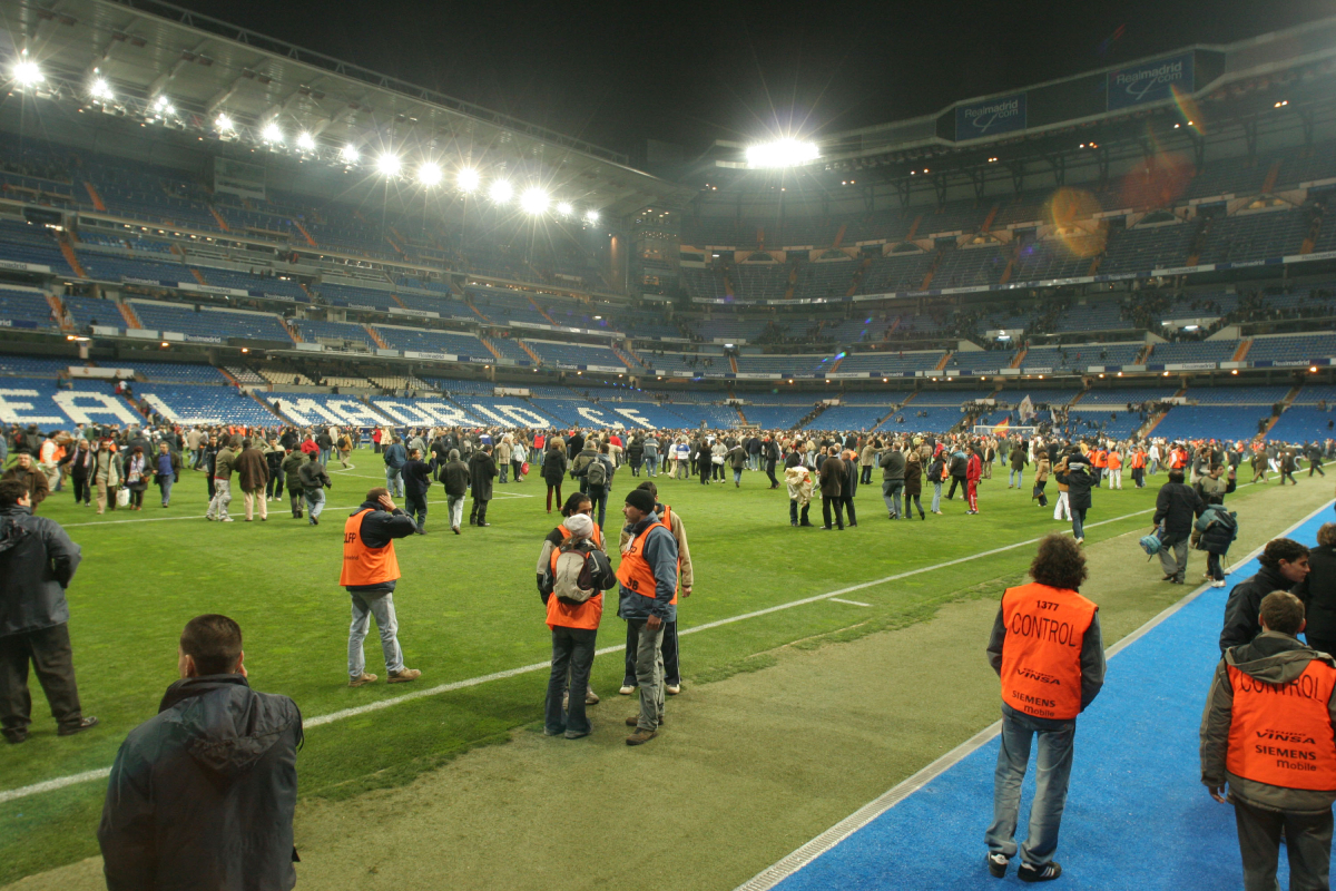 MADRID, SPAIN - DECEMBER 12: People evacuate Real Madrid?s Bernabeu stadium after a bomb alert during a Primera Liga match against Real Sociedad on December 12, 2004, in Madrid, Spain. (Photo by Denis Doyle/Getty Images)