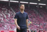 MAINZ, GERMANY - MAY 17: Xabi Alonso, Head Coach of Bayer 04 Leverkusen, looks on prior to the Bundesliga match between 1. FSV Mainz 05 and Bayer 04 Leverkusen at MEWA Arena on May 17, 2025 in Mainz, Germany. (Photo by Pau Barrena/Getty Images).