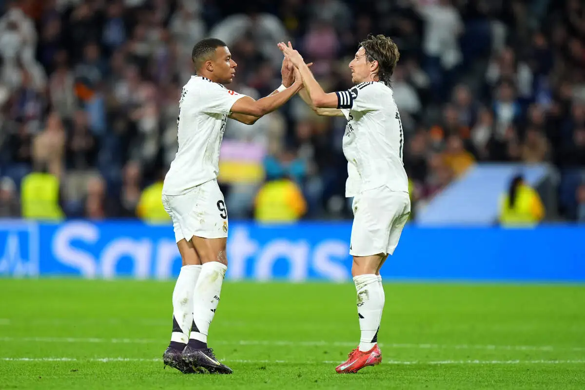 MADRID, SPAIN - MAY 14: Kylian Mbappe of Real Madrid celebrates scoring his team's first goal with Luka Modric during the LaLiga match between Real Madrid CF and RCD Mallorca at Estadio Santiago Bernabeu on May 14, 2025 in Madrid, Spain. (Photo by Angel Martinez/Getty Images)