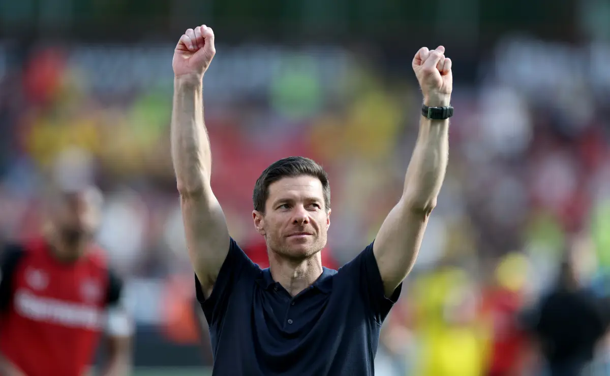 LEVERKUSEN, GERMANY - MAY 11: Xabi Alonso, Head Coach of Bayer 04 Leverkusen, celebrates with fans after the Bundesliga match between Bayer 04 Leverkusen and Borussia Dortmund at BayArena on May 11, 2025 in Leverkusen, Germany. (Photo by Lars Baron/Getty Images)