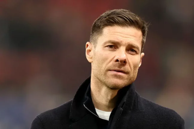 LEVERKUSEN, GERMANY - MARCH 11: Xabi Alonso, Head Coach of Bayer 04 Leverkusen, looks on during the UEFA Champions League 2024/25 UEFA Champions League 2024/25 Round of 16 second leg match between Bayer 04 Leverkusen and FC Bayern München at on March 11, 2025 in Leverkusen, Germany. (Photo by Lars Baron/Getty Images).