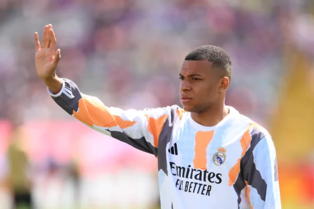 BARCELONA, SPAIN - MAY 11: Kylian Mbappe of Real Madrid gestures during the warm up prior to the LaLiga match between FC Barcelona and Real Madrid CF at Estadi Olimpic Lluis Companys on May 11, 2025 in Barcelona, Spain. (Photo by David Ramos/Getty Images)