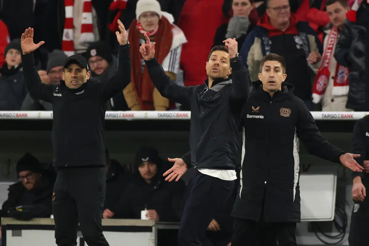 MUNICH, GERMANY - DECEMBER 03: Head coach Xabi Alonso of Bayer 04 Leverkusen and staff react during the DFB Cup round of 16 match between FC Bayern München and Bayer 04 Leverkusen at Allianz Arena on December 03, 2024 in Munich, Germany. (Photo by Alex Grimm/Getty Images)
