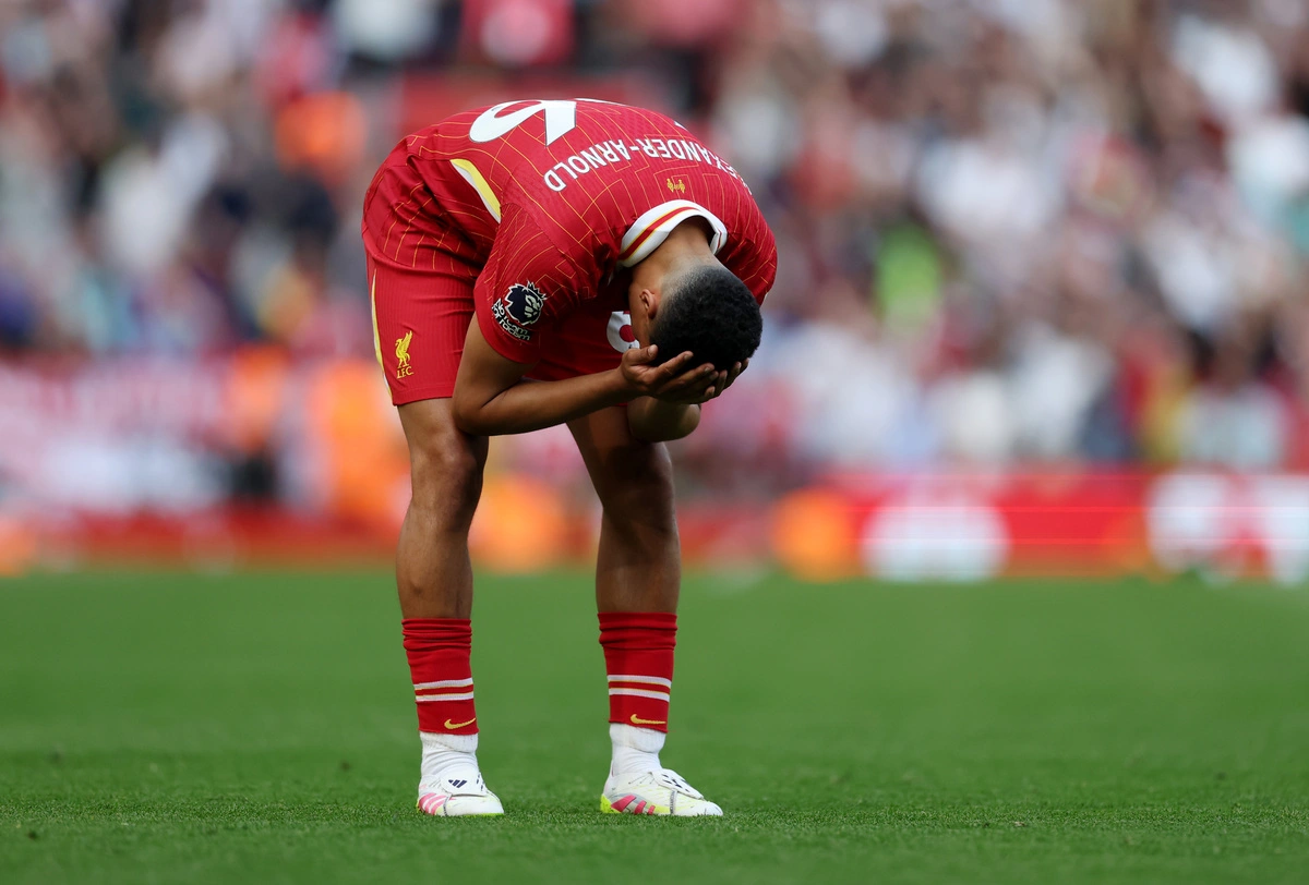 LIVERPOOL, ENGLAND - MAY 11: Trent Alexander-Arnold of Liverpool reacts during the Premier League match between Liverpool FC and Arsenal FC at Anfield on May 11, 2025 in Liverpool, England. (Photo by Carl Recine/Getty Images)