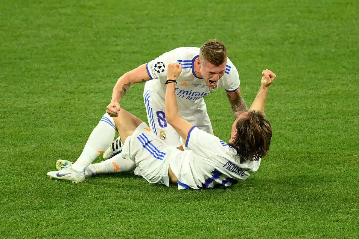 PARIS, FRANCE - MAY 28: Toni Kroos and Luka Modric of Real Madrid celebrate after their sides victory during the UEFA Champions League final match between Liverpool FC and Real Madrid at Stade de France on May 28, 2022 in Paris, France. (Photo by Matthias Hangst/Getty Images)