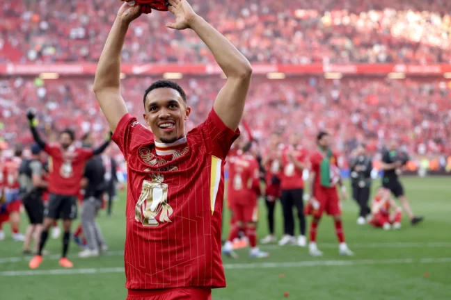 LIVERPOOL, ENGLAND - APRIL 27: Trent Alexander-Arnold of Liverpool celebrates the teams victory and confirmation of winning the Premier League title after the Premier League match between Liverpool FC and Tottenham Hotspur FC at Anfield on April 27, 2025 in Liverpool, England.