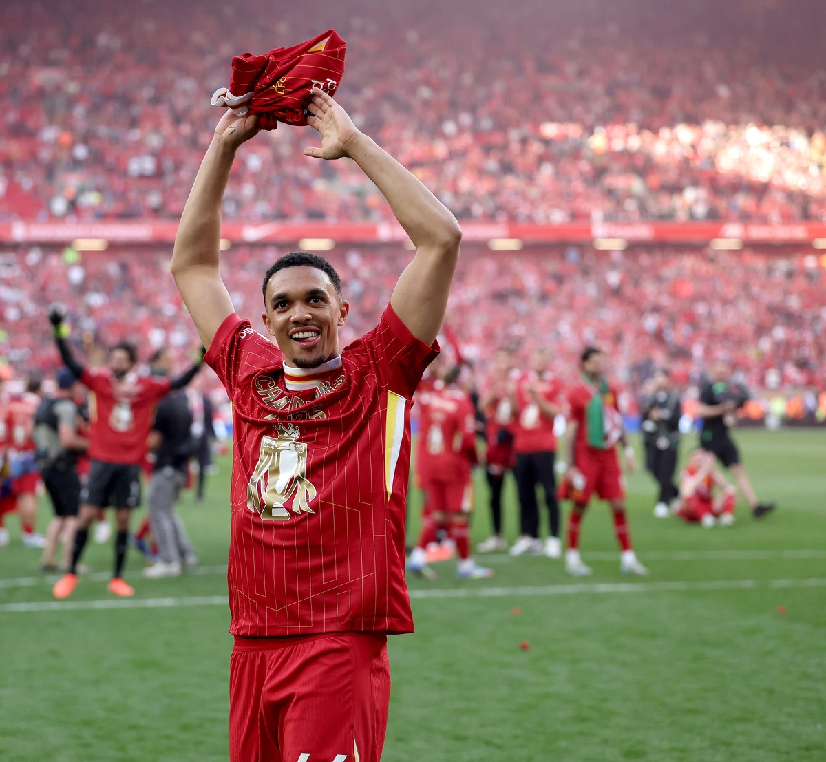 LIVERPOOL, ENGLAND - APRIL 27: Trent Alexander-Arnold of Liverpool celebrates the teams victory and confirmation of winning the Premier League title after the Premier League match between Liverpool FC and Tottenham Hotspur FC at Anfield on April 27, 2025 in Liverpool, England.