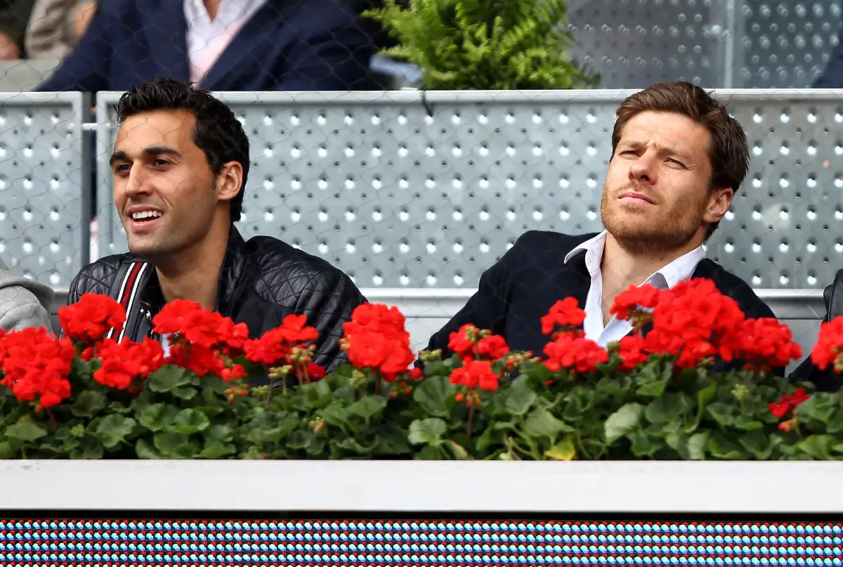 MADRID, SPAIN - MAY 14: Real Madrid soccer players Alvaro Arbeloa and Xabi Alonso watches Rafael Nadal of Spain against Gael Monfils of France in their quarter final match during the Mutua Madrilena Madrid Open tennis tournament at the Caja Magica on May 14, 2010 in Madrid, Spain. (Photo by Clive Brunskill/Getty Images)