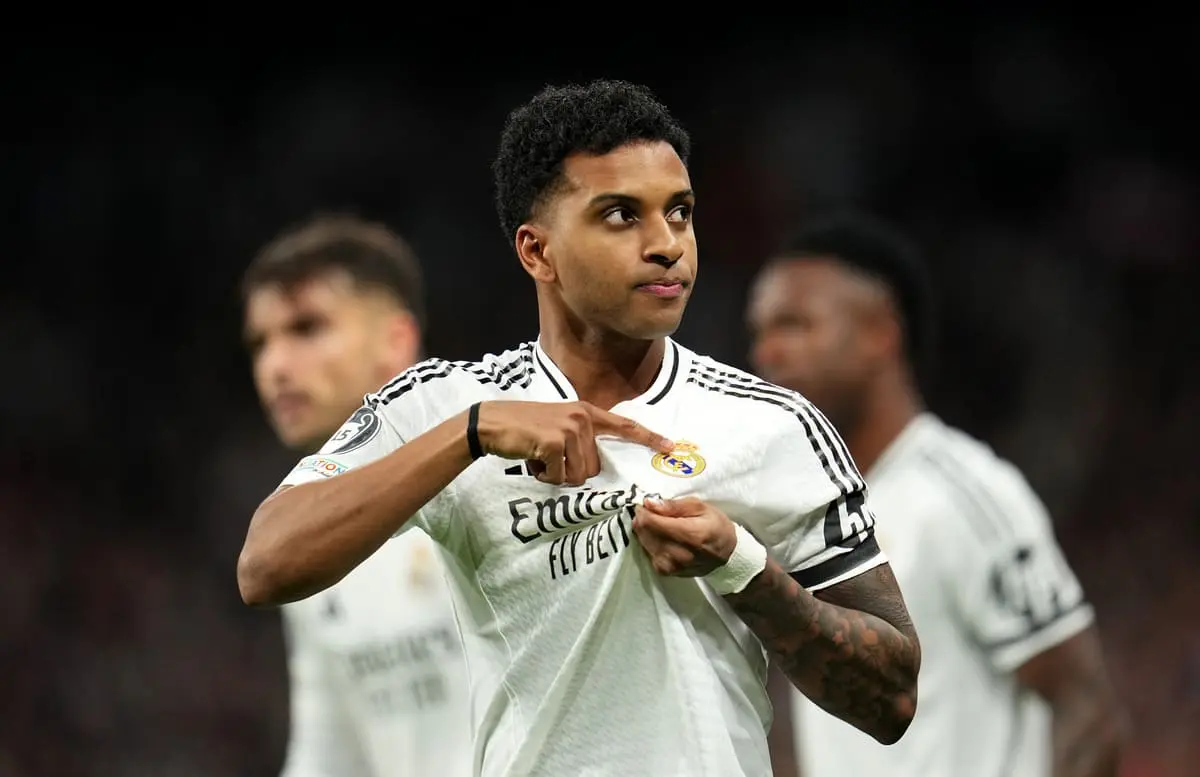MADRID, SPAIN - MARCH 04: Rodrygo of Real Madrid celebrates scoring his team's first goal during the UEFA Champions League 2024/25 Round of 16 first leg match between Real Madrid C.F. and Atletico de Madrid at Santiago Bernabeu Stadium on March 04, 2025 in Madrid, Spain. (Photo by Aitor Alcalde/Getty Images)