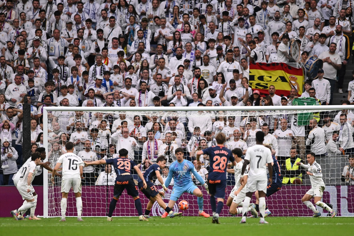 MADRID, SPAIN - MAY 04: Javi Rodriguez of Celta Vigo scores his team's first goal as Thibaut Courtois of Real Madrid fails to make a save during the LaLiga match between Real Madrid CF and RC Celta de Vigo at Estadio Santiago Bernabeu on May 04, 2025 in Madrid, Spain. (Photo