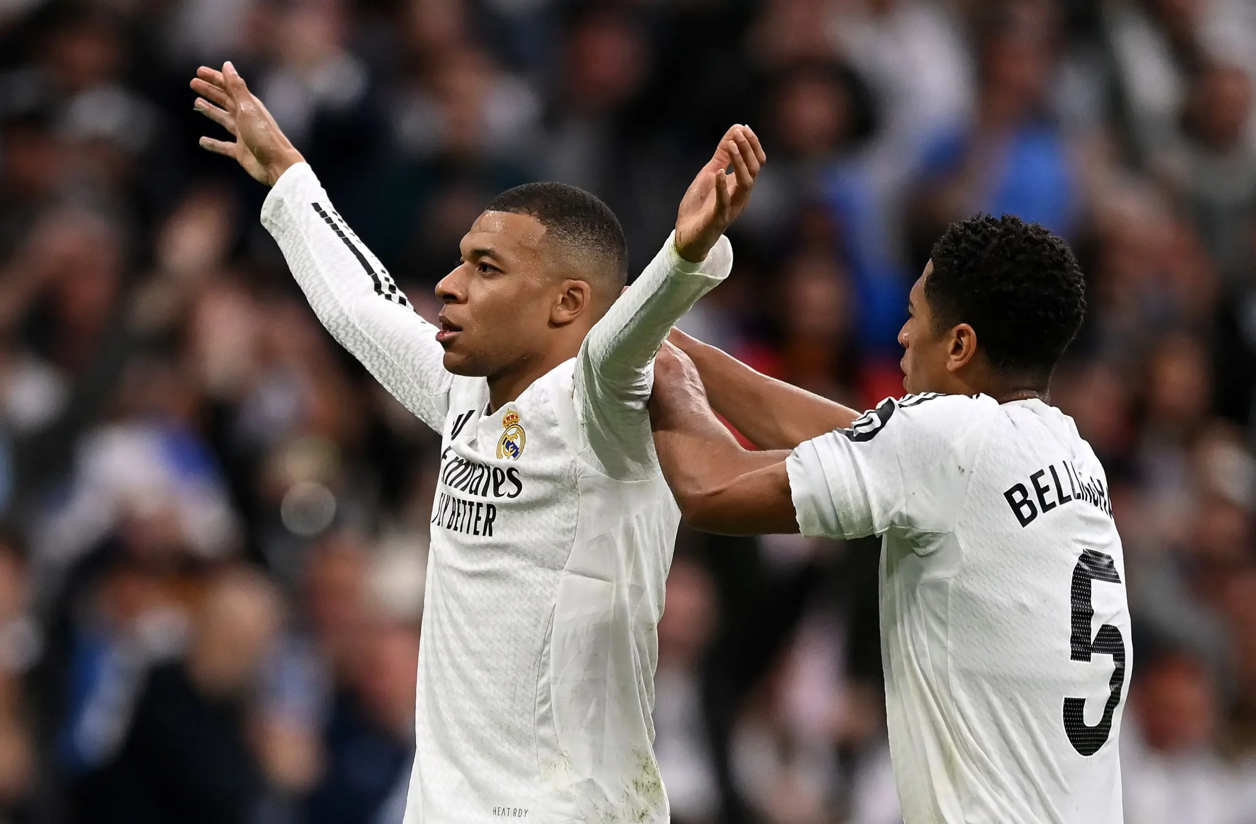 MADRID, SPAIN - MAY 04: Kylian Mbappe of Real Madrid celebrates scoring his team's second goal with teammate Jude Bellingham during the LaLiga match between Real Madrid CF and RC Celta de Vigo at Estadio Santiago Bernabeu on May 04, 2025 in Madrid, Spain. (Photo by Denis Doyle/Getty Images).