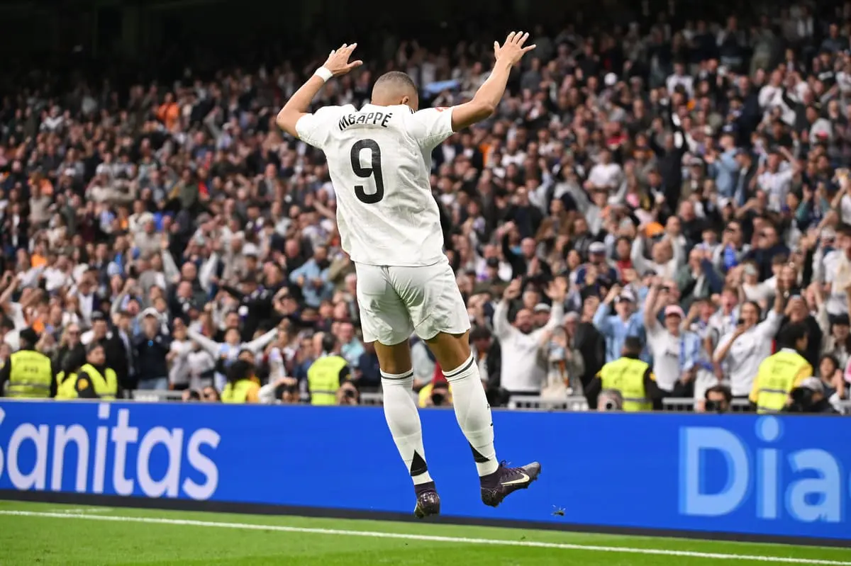 MADRID, SPAIN - MAY 04: Kylian Mbappe of Real Madrid celebrates scoring his team's third goal during the LaLiga match between Real Madrid CF and RC Celta de Vigo at Estadio Santiago Bernabeu on May 04, 2025 in Madrid, Spain. (Photo by Denis Doyle/Getty Images).