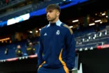 MADRID, SPAIN - MAY 14: Raul Asencio of Real Madrid inspects the pitch prior to the LaLiga match between Real Madrid CF and RCD Mallorca at Estadio Santiago Bernabeu on May 14, 2025 in Madrid, Spain. (Photo by Angel Martinez/Getty Images)
