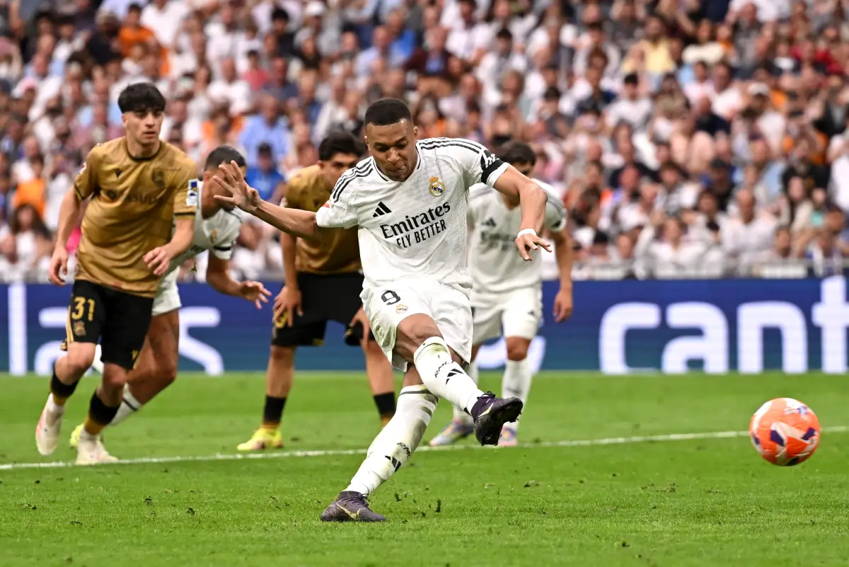 MADRID, SPAIN - MAY 24: Kylian Mbappe of Real Madrid scores his team's first goal from the penalty spot during the LaLiga match between Real Madrid CF and Real Sociedad at Estadio Santiago Bernabeu on May 24, 2025 in Madrid, Spain. (Photo by Denis Doyle/Getty Images)