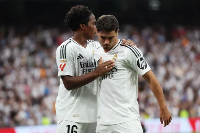MADRID, SPAIN - AUGUST 25: Brahim Díaz of Real Madrid celebrates scoring his team's second goal with teammate Endrick during the La Liga match between Real Madrid CF and Real Valladolid CF at Estadio Santiago Bernabeu on August 25, 2024 in Madrid, Spain. (Photo by Florencia Tan Jun/Getty Images)