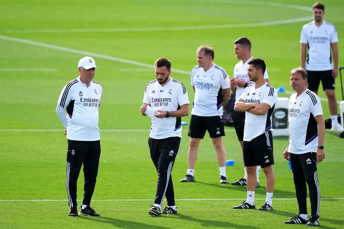 MADRID, SPAIN - MAY 08: Carlo Ancelotti, Head Coach of Real Madrid, and Davide Ancelotti, Assistant Head Coach of Real Madrid, discuss during the Real Madrid training session ahead of their UEFA Champions League semi-final first leg match against Manchester City FC at Valdebebas training ground on May 08, 2023 in Madrid, Spain. (Photo by Angel Martinez/Getty Images)