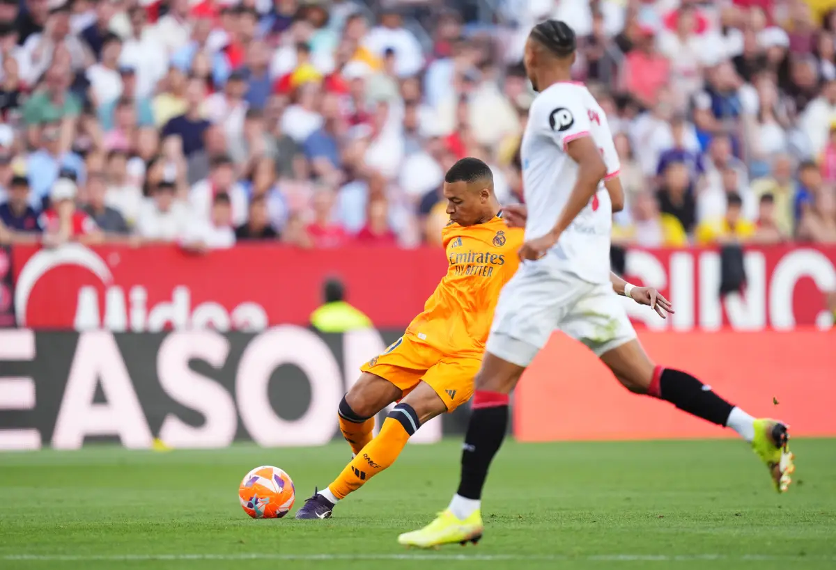 SEVILLE, SPAIN - MAY 18: Kylian Mbappe of Real Madrid scores his team's first goal during the LaLiga match between Sevilla FC and Real Madrid CF at Estadio Ramon Sanchez Pizjuan on May 18, 2025 in Seville, Spain. (Photo by Angel Martinez/Getty Images)