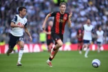 LONDON, ENGLAND - MARCH 09: Dean Huijsen of AFC Bournemouth runs with the ball whilst under pressure from Brennan Johnson of Tottenham Hotspur during the Premier League match between Tottenham Hotspur FC and AFC Bournemouth at the Tottenham Hotspur Stadium on March 09, 2025 in London, England. (Photo by Justin Setterfield/Getty Images)