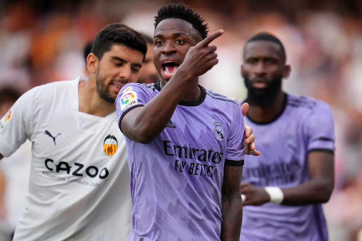 VALENCIA, SPAIN - MAY 21: Vinicius Junior of Real Madrid reacts after receiving Racist abuse via gestures made by fans during the LaLiga Santander match between Valencia CF and Real Madrid CF at Estadio Mestalla on May 21, 2023 in Valencia, Spain. (Photo by Aitor Alcalde/Getty Images) Valence