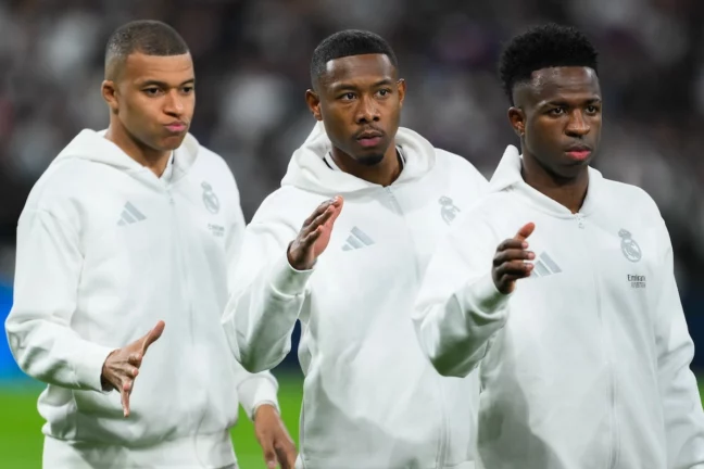 MADRID, SPAIN - APRIL 16: Kylian Mbappe, David Alaba and Vinícius Júnior of Real Madrid look on during the UEFA Champions League 2024/25 Quarter Final Second Leg match between Real Madrid C.F. and Arsenal FC at Estadio Santiago Bernabeu on April 16, 2025 in Madrid, Spain. (Photo by David Ramos/Getty Images)