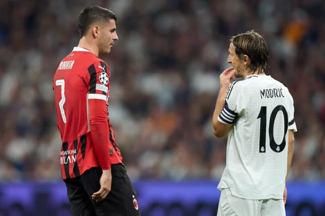MADRID, SPAIN - NOVEMBER 05: Luka Modric of Real Madrid and Alvaro Morata of AC Milan interact during the UEFA Champions League 2024/25 League Phase MD4 match between Real Madrid C.F. and AC Milan at Estadio Santiago Bernabeu on November 05, 2024 in Madrid, Spain. (Photo by Angel Martinez/Getty Images)