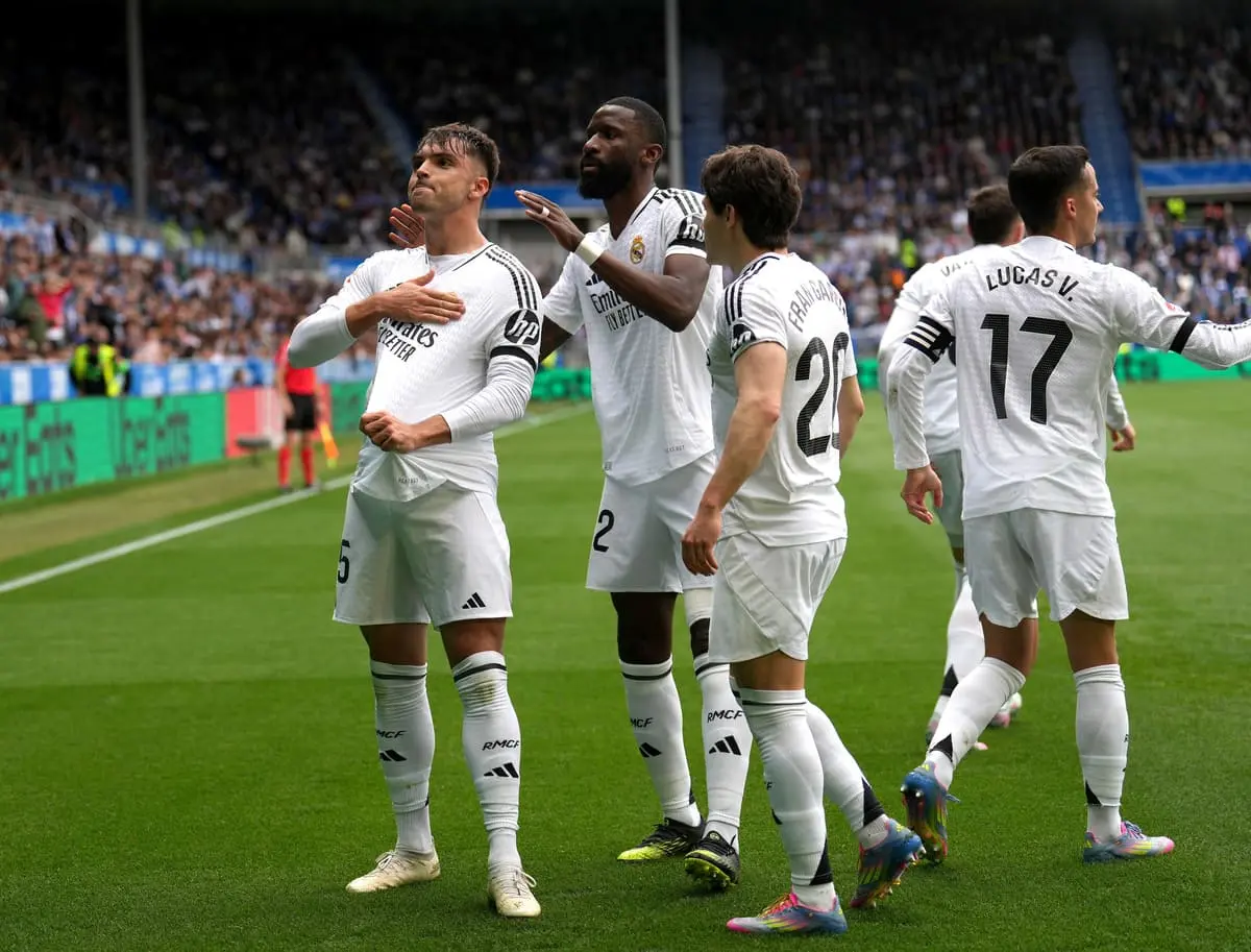 VITORIA-GASTEIZ, SPAIN - APRIL 13: Raul Asencio of Real Madrid celebrates scoring a goal with teammate Antonio Ruediger, which was later ruled out following a VAR Review which concluded their was a foul in the build up, during the LaLiga match between Deportivo Alaves and Real Madrid CF at Estadio de Mendizorroza on April 13, 2025 in Vitoria-Gasteiz, Spain. (Photo by Juan Manuel Serrano Arce/Getty Images)