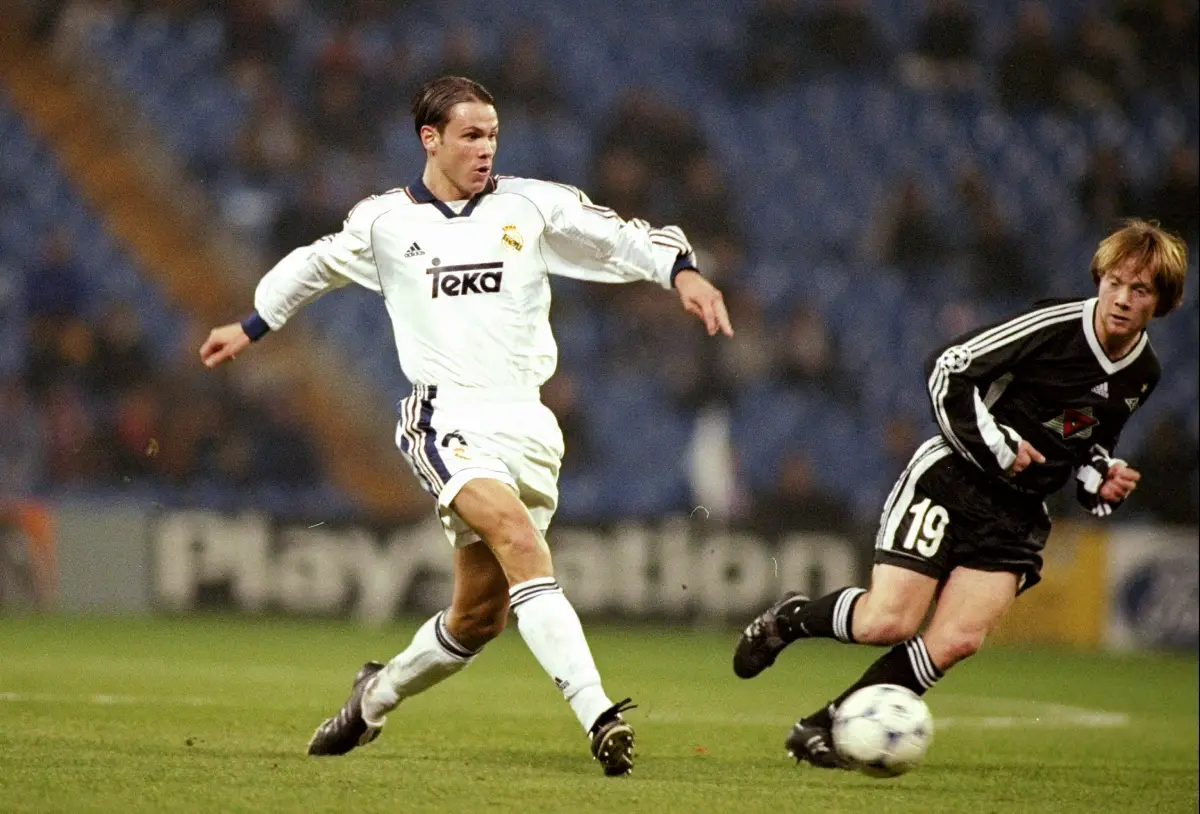 7 Dec 1999: Fernando Redondo of Real Madrid is watched by Fredrik Winsnes of Rosenborg during the UEFA Champions League group C match at the Bernabeu Stadium in Madrid, Spain. Real Madrid won 3-1. \ Mandatory Credit: Clive Mason /Allsport