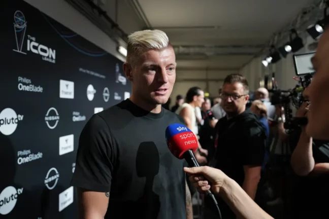 COLOGNE, GERMANY - SEPTEMBER 01: Toni Kroos, German former football player, is interviewed by Sky News Sport Channel prior to the first matchday of the Icon League at Lanxess Arena on September 01, 2024 in Cologne, Germany. The Icon League, was founded in November last year. The aim of the small-sided indoor soccer league is to maximise the highlights of the game and create an innovative football spectacle. (Photo by Pau Barrena/Getty Images)